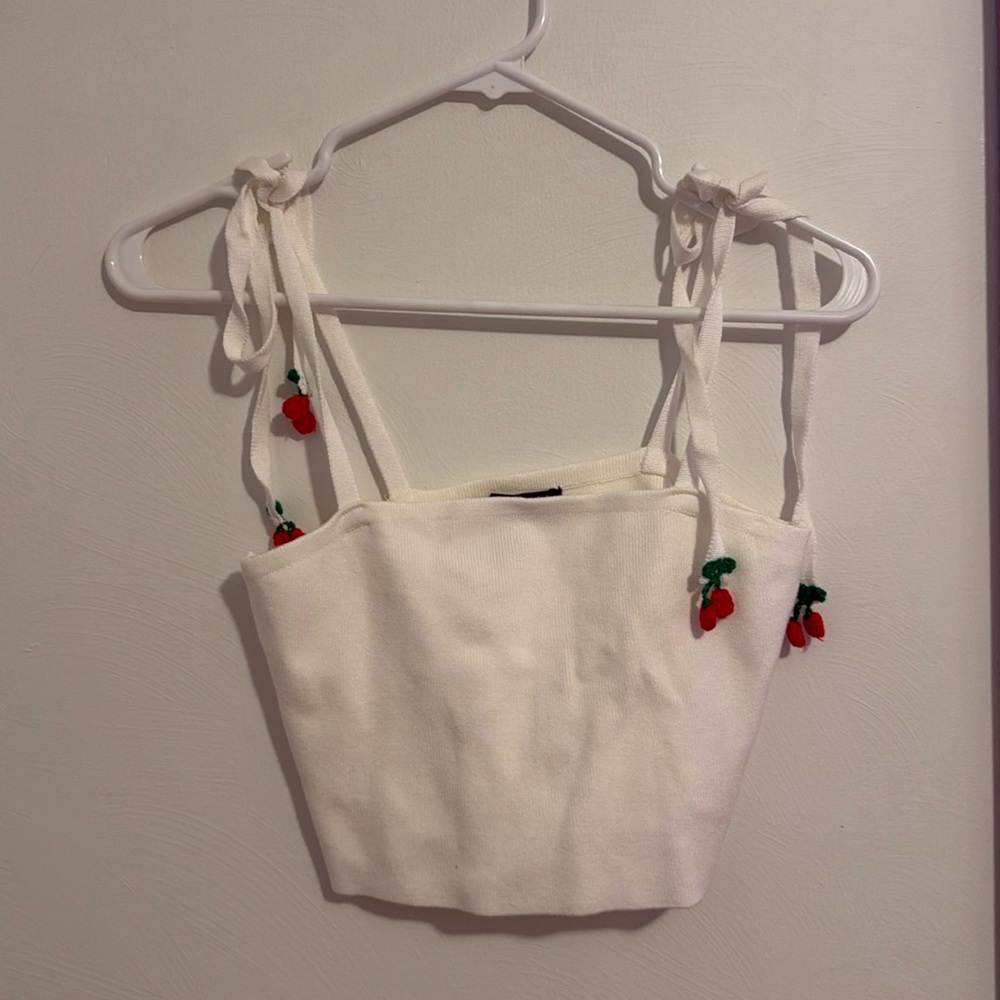 Knit crop top with crochet cherries